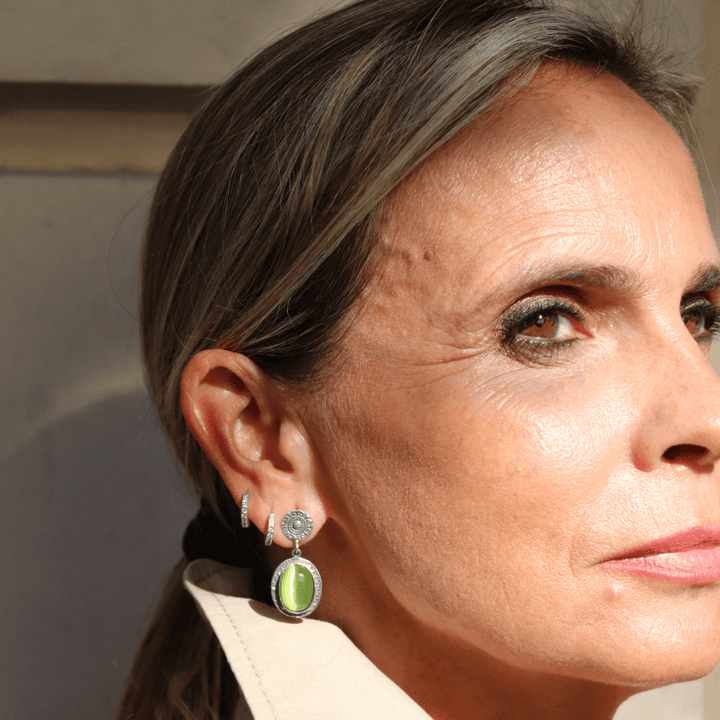 Sei Damenohrringe aus 925er Silber und grünem Stein