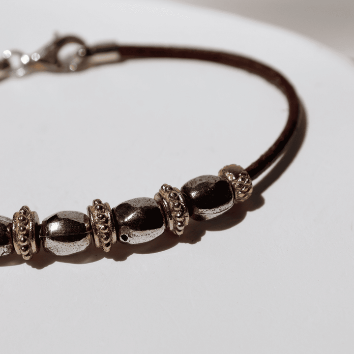 Pulsera Mujer Kojin de cuero fino con óvalos de plata 925 y cuentas de bronce