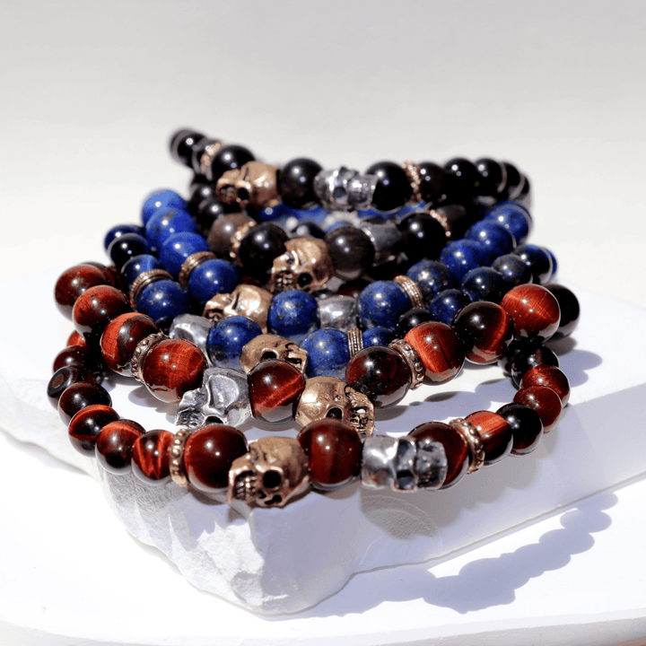 Kaizen bull's eye bead bracelet with 925 silver and bronze skulls