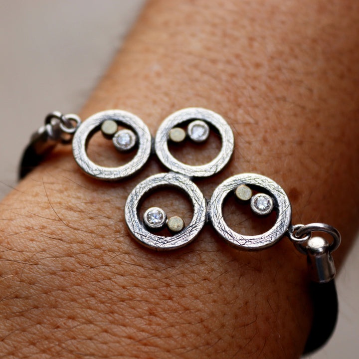 Women's leather bracelet with 925 silver spirals and bronze dots