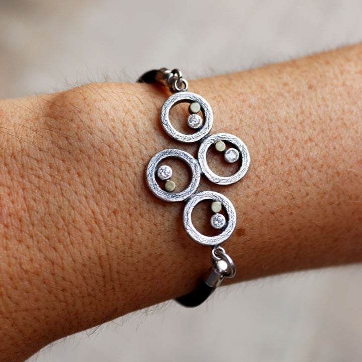 Women's leather bracelet with 925 silver spirals and bronze dots